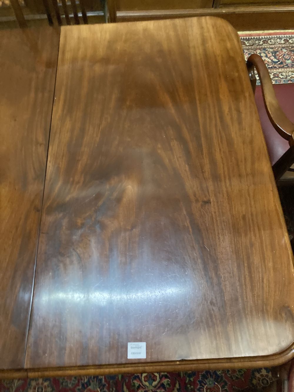 A Victorian mahogany extending dining table, 230cm extended (two spare leaves), width 120cm height 74cm
